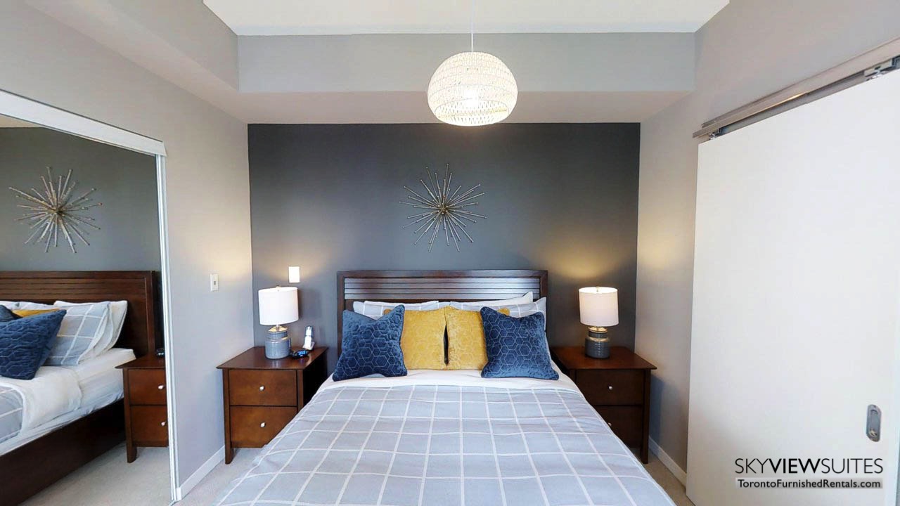 MLS serviced apartments toronto blue pillow bedroom