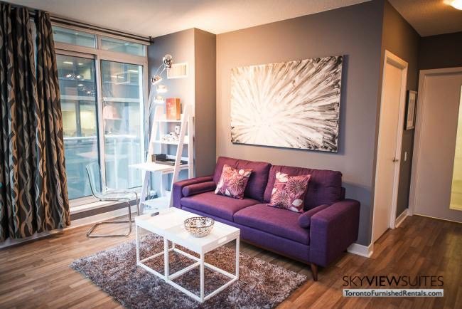 King and Yonge executive rentals toronto living room purple couch