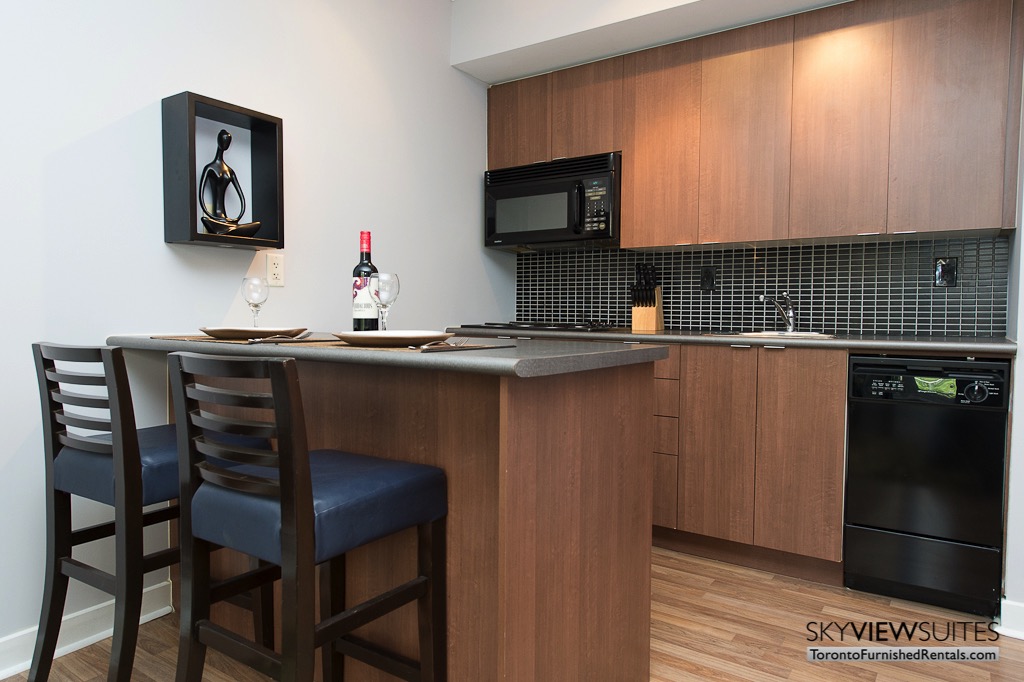 8 Colborne Street short term rental toronto kitchen island and bottle of red wine