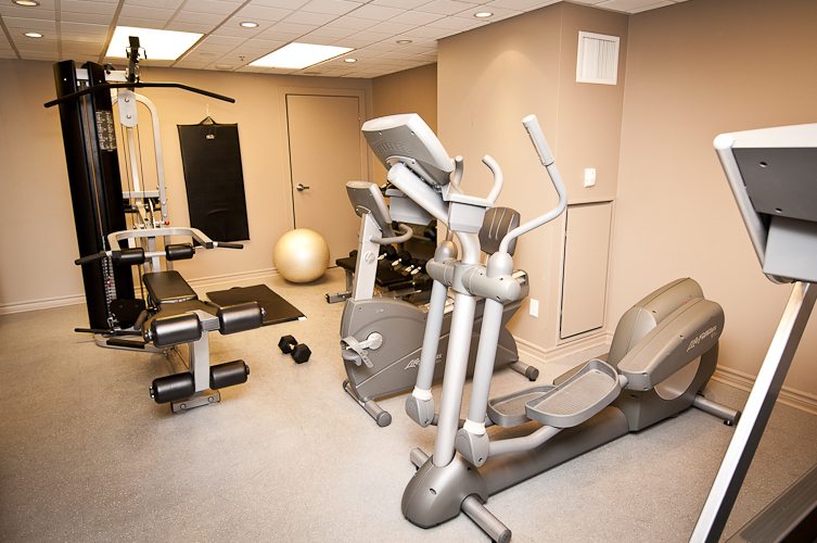 King and Yonge executive rentals toronto gym featuring elliptical