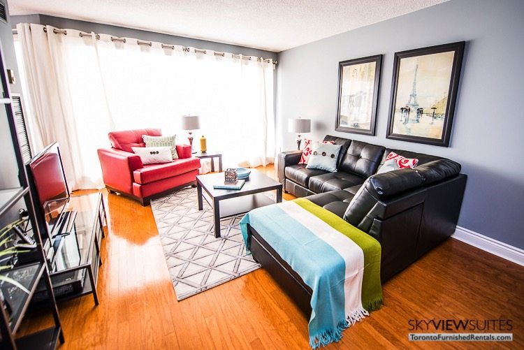 serviced apartments toronto marina del ray living room couch and red chair