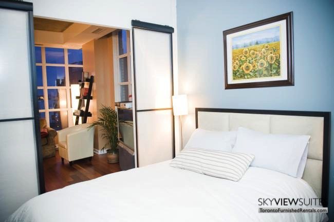 furnished suites toronto 23 Brant Street bedroom and living room