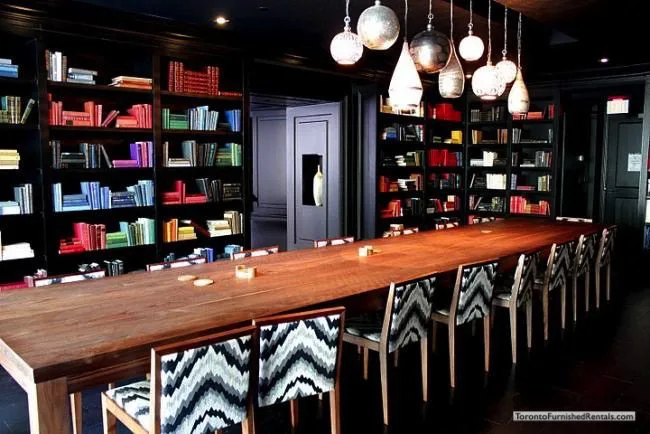 corporate housing toronto 1 Scott Street long table and bookshelves