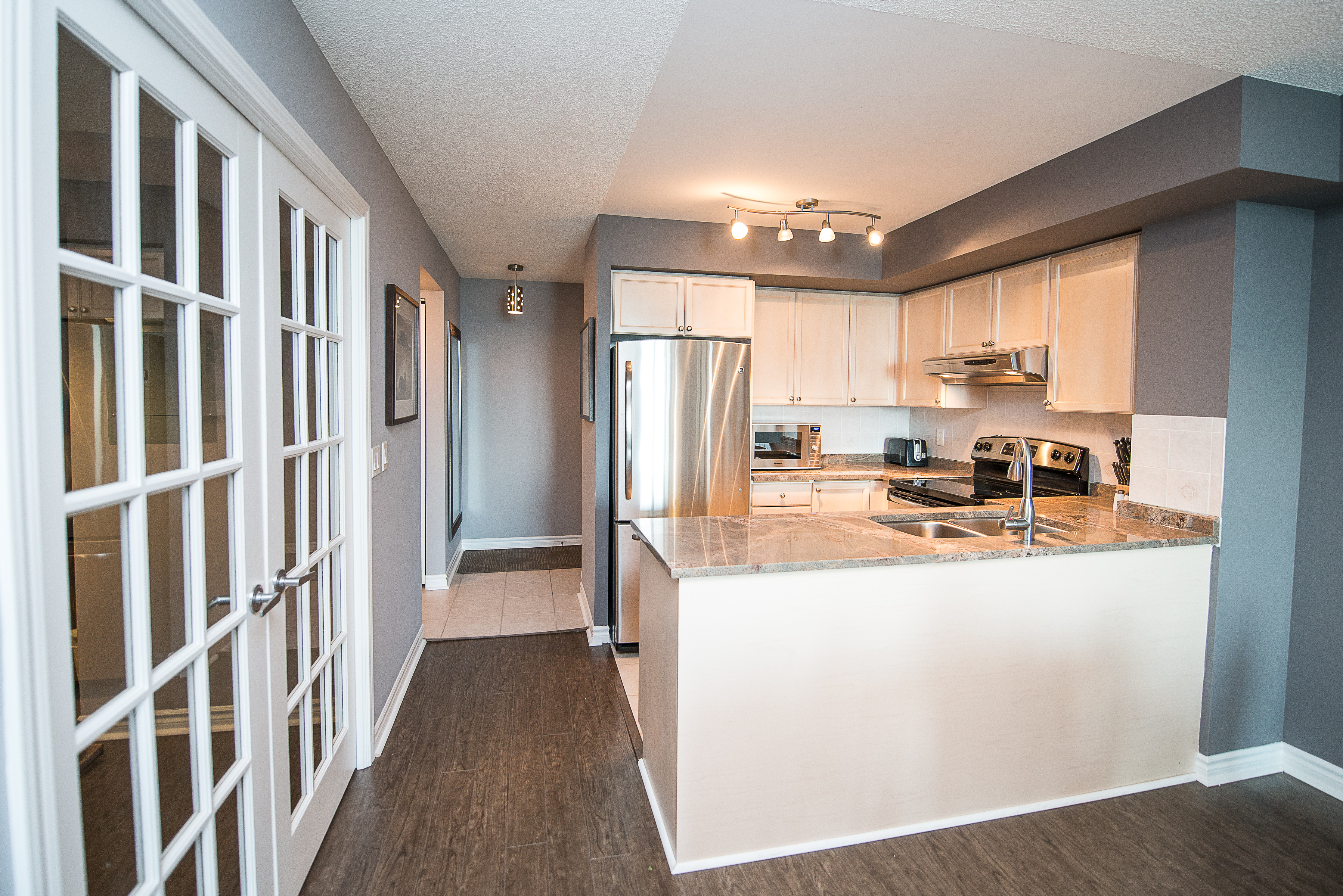 short term rentals toronto the empire kitchen with counter and fridge