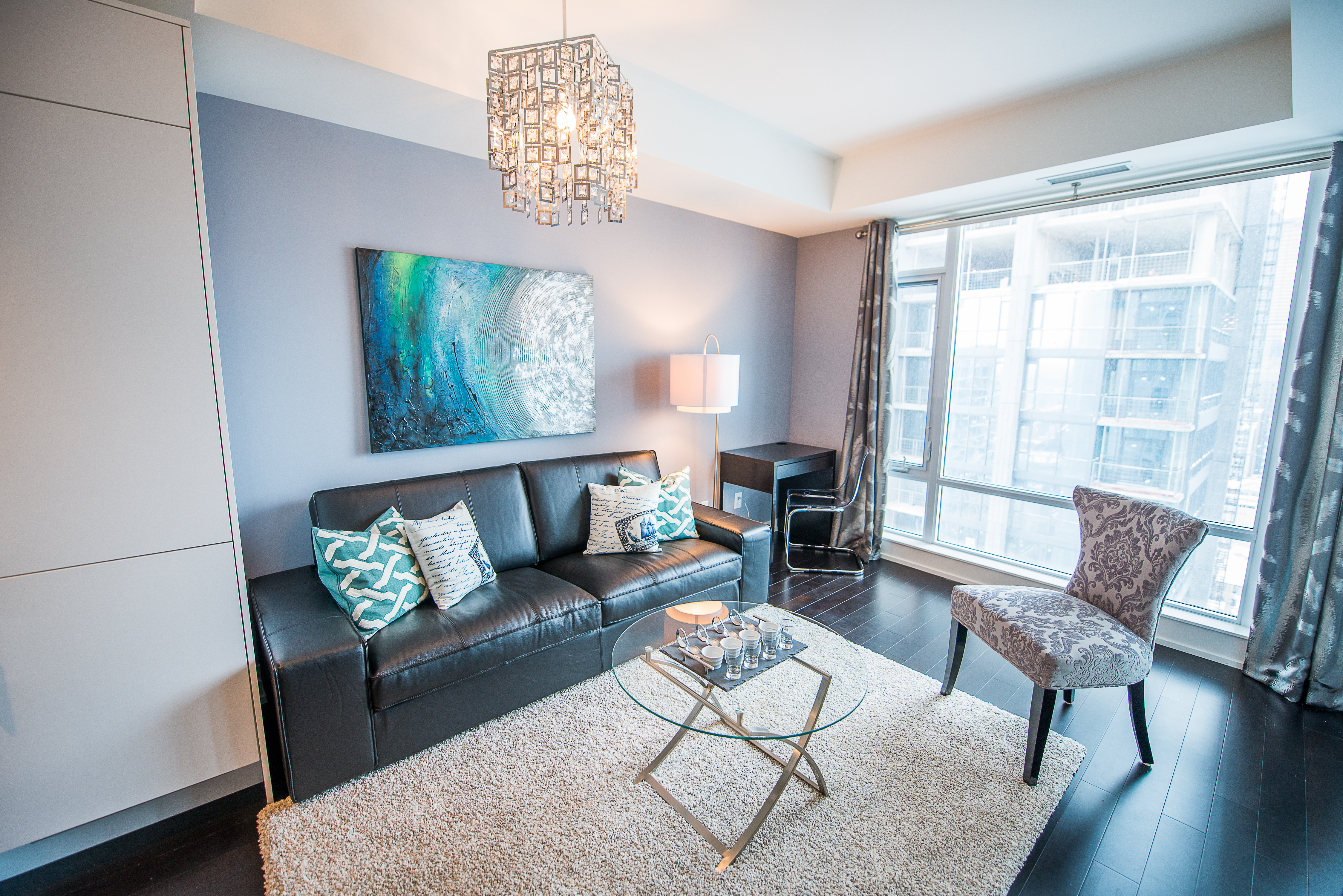 corporate rentals toronto king and john living room with couch and coffee table