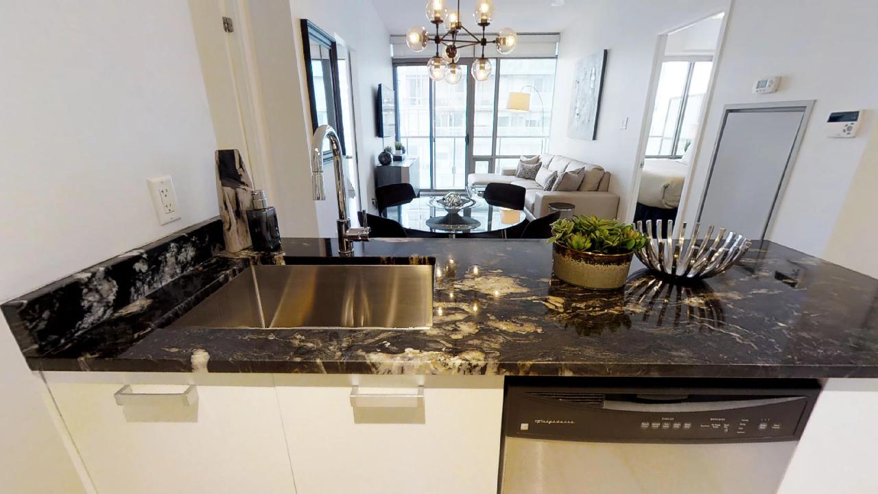 The kitchen counter in a Murano furnished condominium in toronto