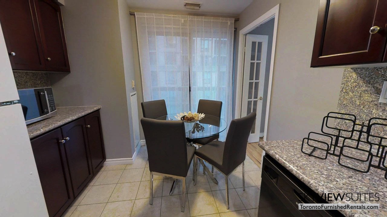 short term rentals toronto qwest kitchen table with microwave and balcony
