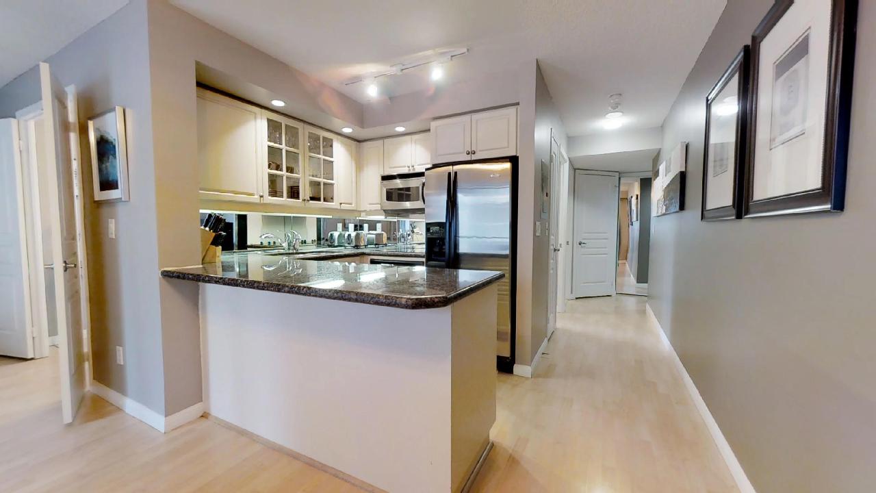 hallway and kitchen of a toronto furnished apartment near st andrew station