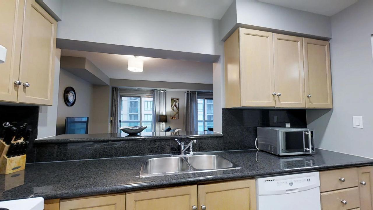 the kitchen window of a Toronto furnished apartment unit located near the Shangri-La Hotel