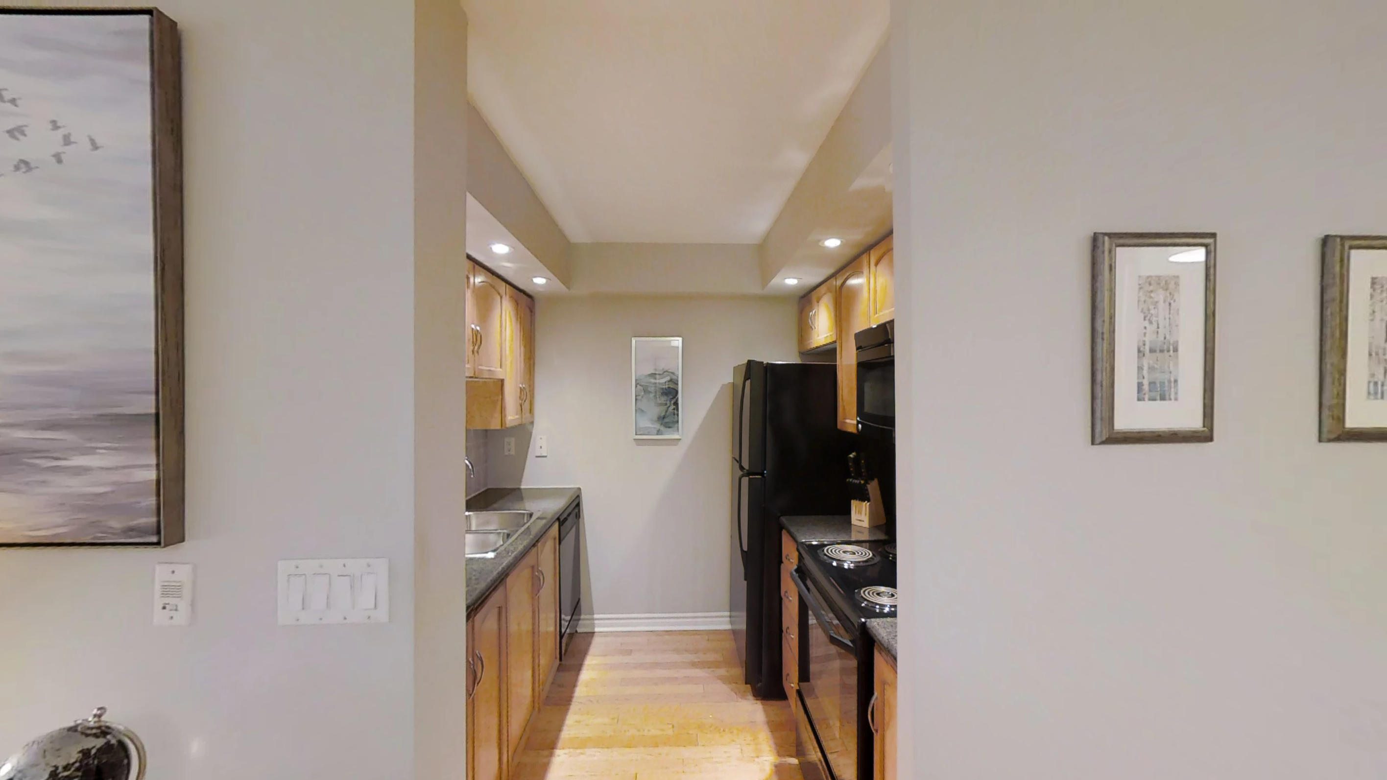 a view of the furnished kitchen of a toronto condo near Wellingont and Blue Jays Way