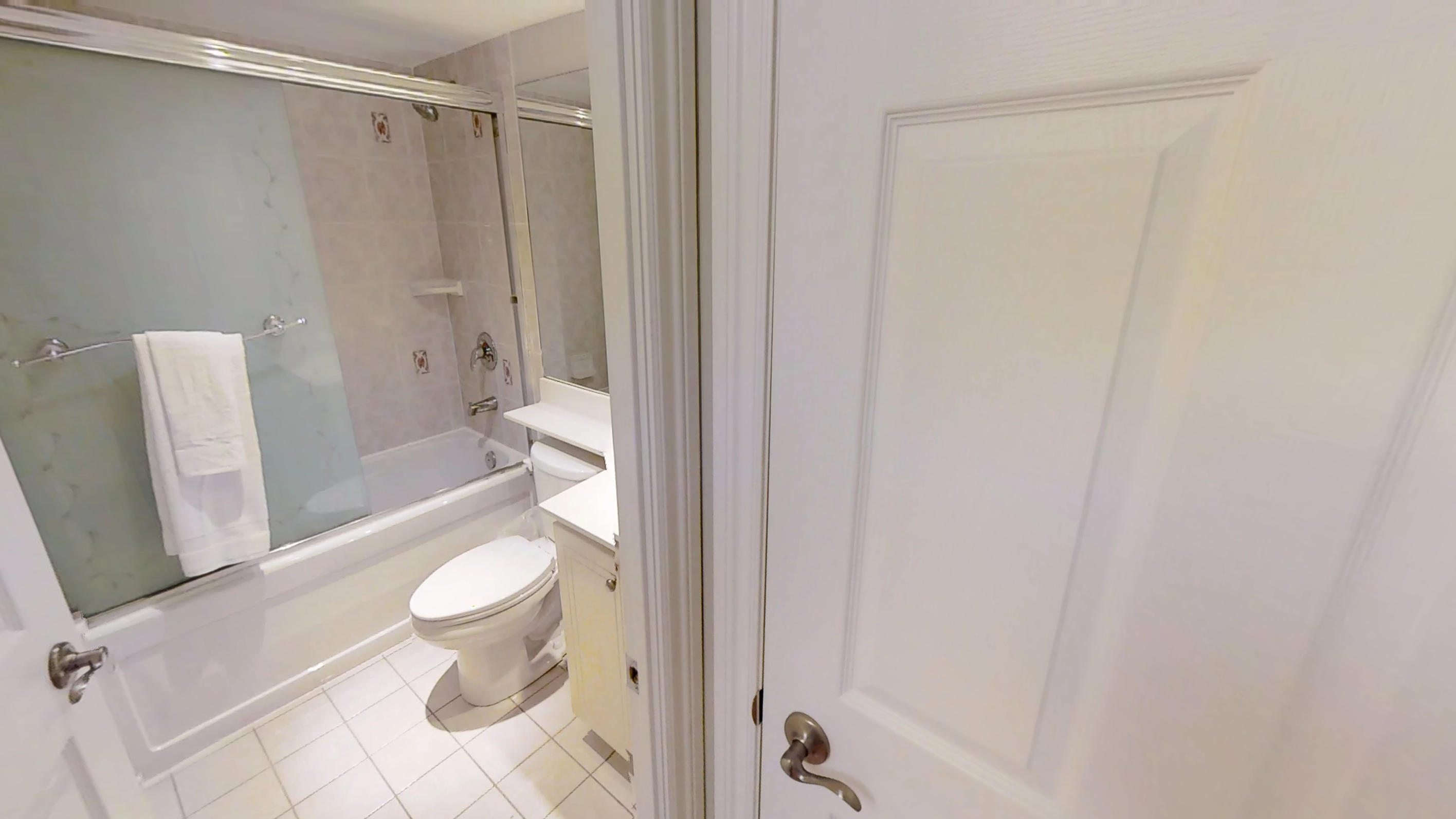 Bathroom and door in a toronto furnished apartment near wellingont and blue jays way, Downtown Toronto.